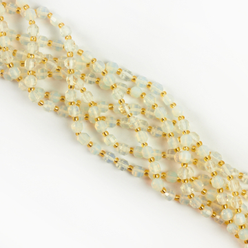 Opal syntetyczny baryłka fasetowana 6mm