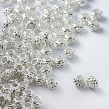 Koralik metalowy oponka z kolcami 6,5mm