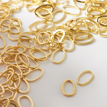 Łącznik metalowy owal błyszczący 12x7mm Łącznik metalowy owal błyszczący 12x7mm