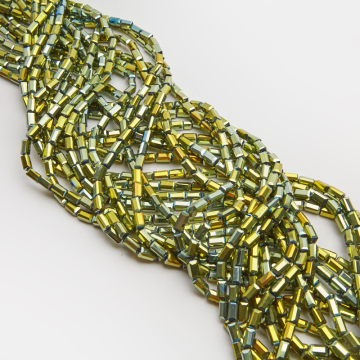 Kryształki słupki fasetowane metallic green 4,5x8,5mm