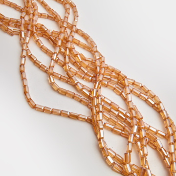 Kryształki słupki fasetowane shampagne AB 4,5x8,5mm