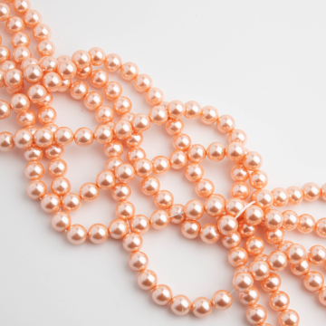 Perły seashell kulka stardust łososiowe 6mm
