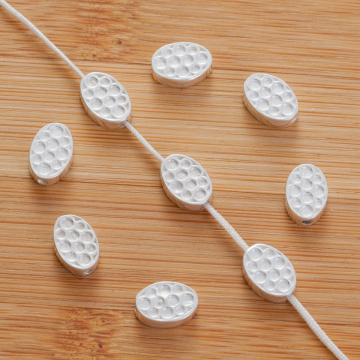 Srebrny koralik owal w kółeczka AG925 9x6,5mm