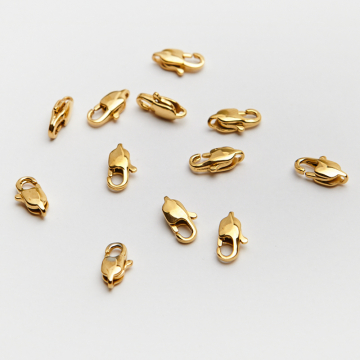 Karabińczyk ozdobny ze stali szlachetnej w kolorze złotym 9mm