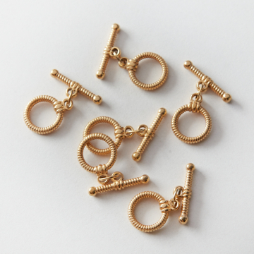 Zapięcie toggle ze stali chirurgicznej nacinane w kolorze złotym 12mm