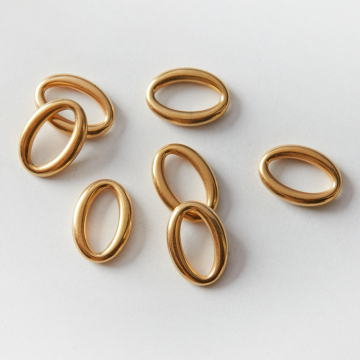 Łącznik ze stali chirurgicznej owal w kolorze złotym 18,5x13mm