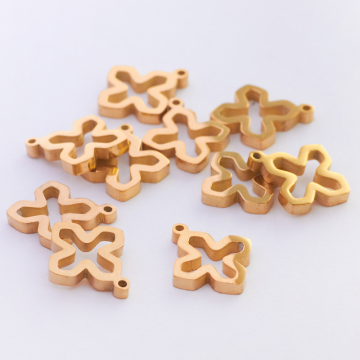 Mini zawieszka ze stali chirurgicznej krzyżyk wycięty w kolorze złotym 10,5mm