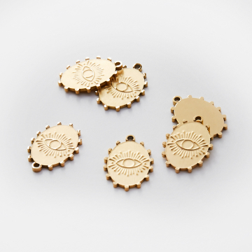 Zawieszka ze stali chirurgicznej grawerowana owal z wypustkami w kolorze złotym 18mm PVD