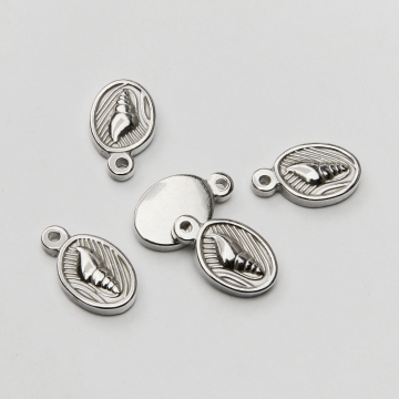 Zawieszka ze stali chirurgicznej muszelka w owalu w kolorze srebrnym 17mm