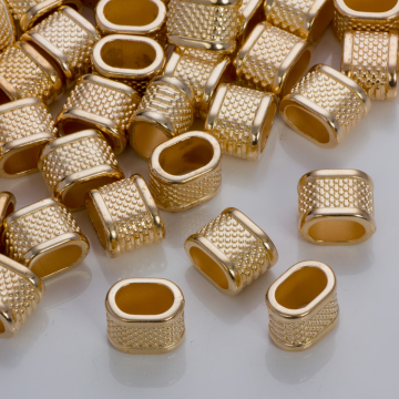 Przekładka w kropeczki do rzemieni w złotym kolorze 14,5x10,5mm