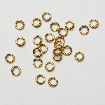 Końcówki okrągłe do nici, linek, sznureczków ze stali chirurgicznej w kolorze złotym 0,7mm