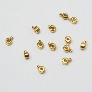 Zacisk w kształcie walca do nici, linek, sznureczków ze stali chirurgicznej w kolorze złotym 0,6mm