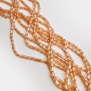 Kryształki słupki fasetowane shampagne AB 4,5x8,5mm