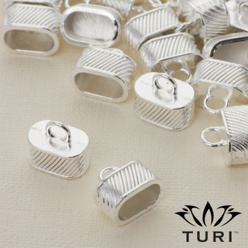 Końcówka do rzemieni z paseczkami w srebrnym kolorze 11.5x6.5mm Końcówka do rzemieni z paseczkami w srebrnym kolorze 11.5x6.5mm