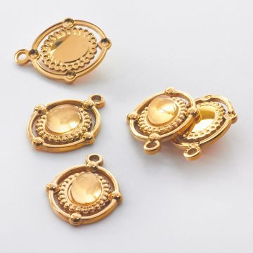 Zawieszka ze stali chirurgicznej owal z białym kryształem górskim w kolorze złotym 21,5mm