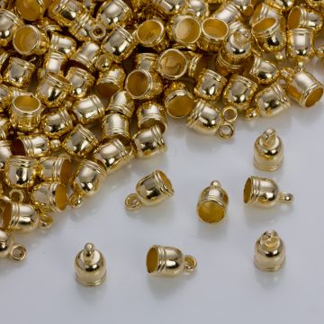 Końcówki do rzemieni i sznurków beczułki w złotym kolorze 5,5mm
