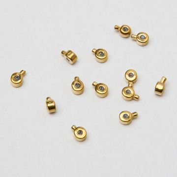 Zacisk w kształcie walca do nici, linek, sznureczków ze stali chirurgicznej w kolorze złotym 0,6mm