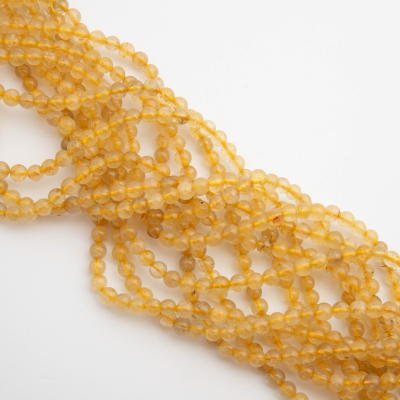 Kryształ górski ze złotym rutylem kulka gładka 4,5mm