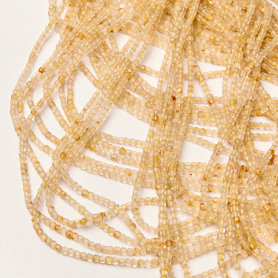 Kryształ górski ze złotym rutylem kostka fasetowana 2x2,5mm