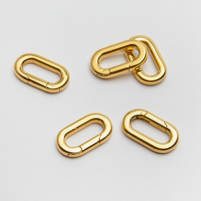 Zapięcie ozdobne owal ze stali szlachetnej w kolorze złotym 10x18mm